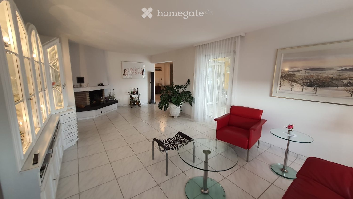 white tiled floor, white walls, fireplace, white cabinet, glass tables, zebra chair, red chair, plant, picture frame