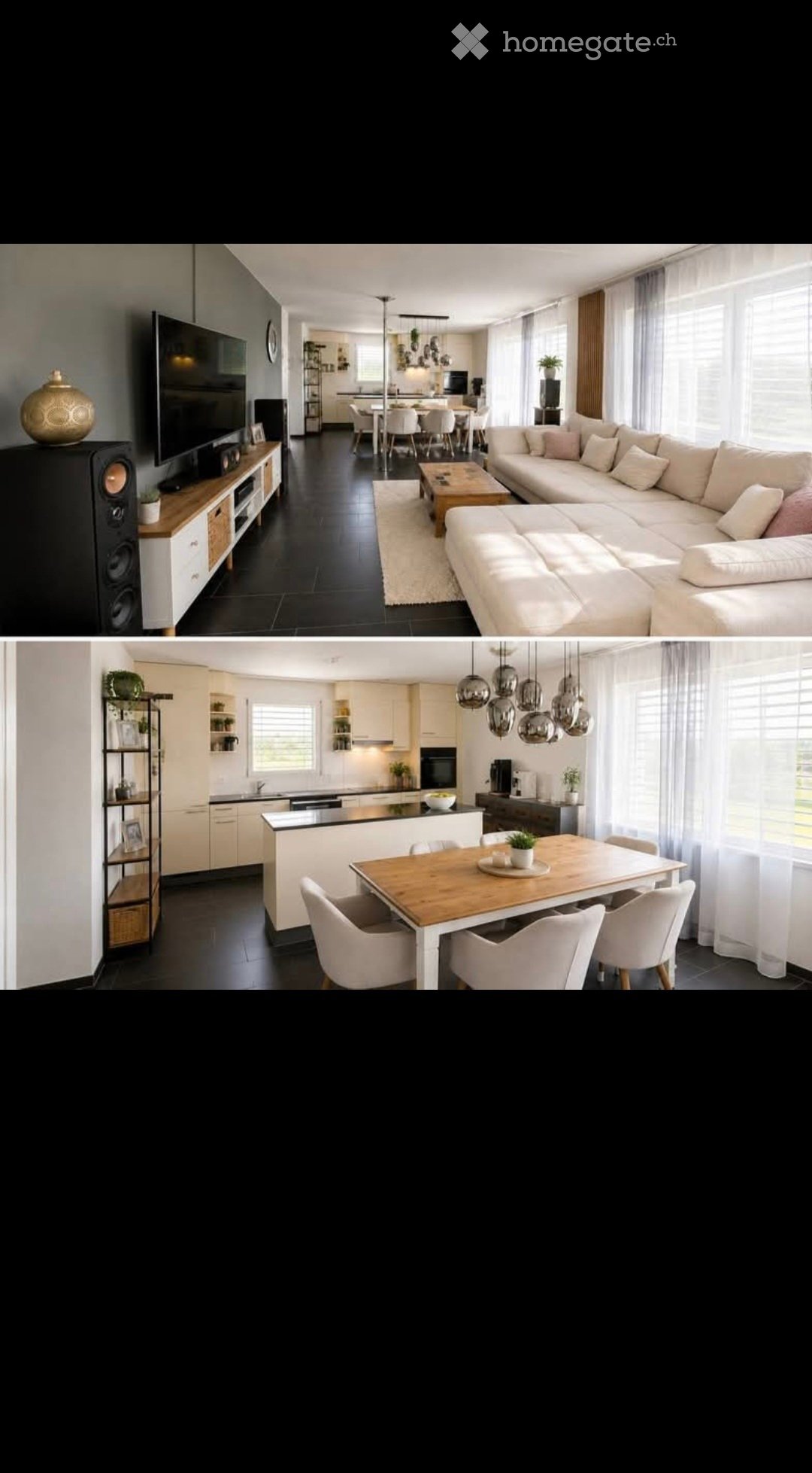 Modern open-plan living and dining area with a large sectional sofa, coffee table, TV stand with speakers, dining table with chairs, and a kitchen island with pendant lights.