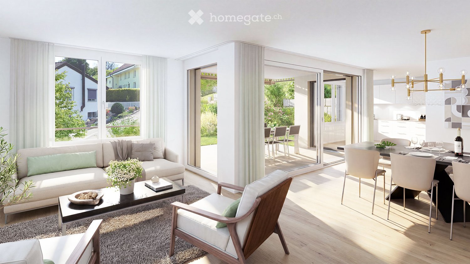 Bright living and dining area with large windows and sliding glass doors leading to a patio. Features a light-colored sofa, coffee table, dining table with chairs, and a chandelier.