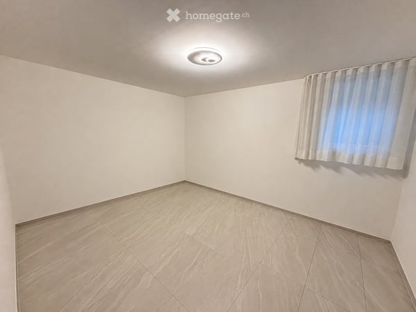 Spazioso 2,5 locali con 55 m² di giardino a Claro 5