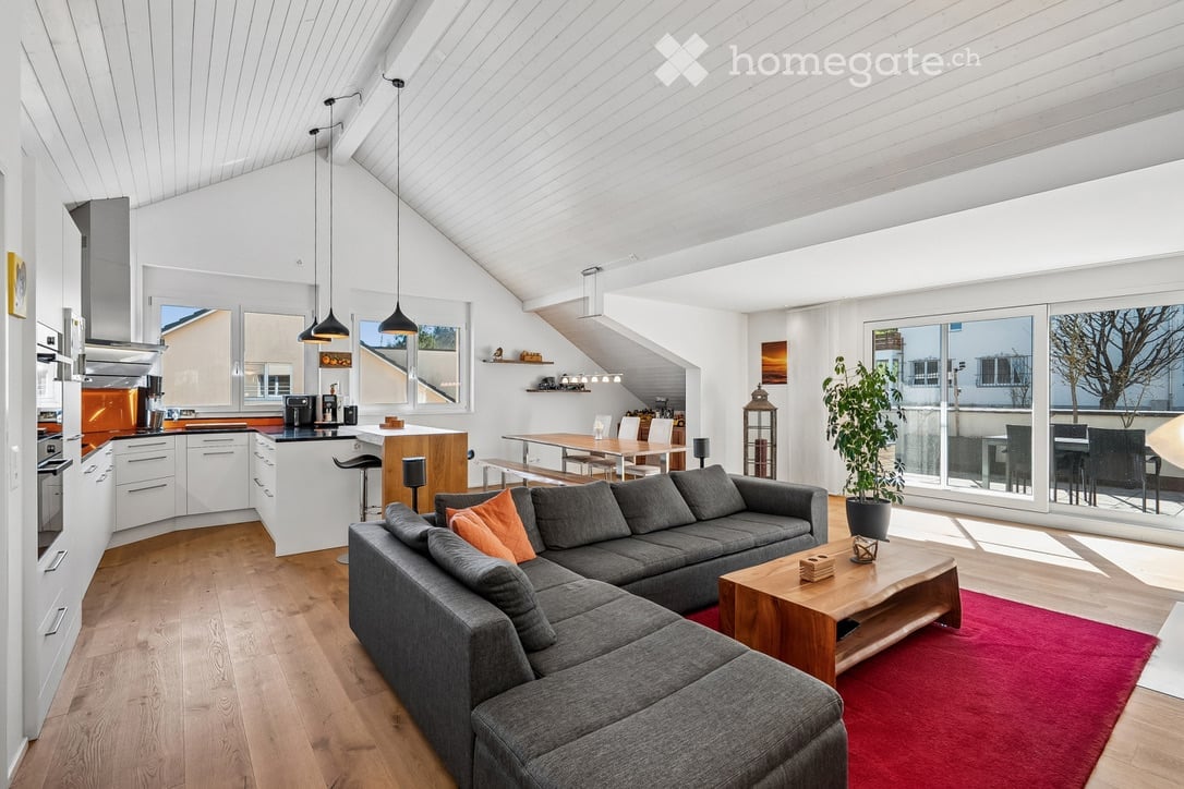 modern living room, gray sofa, wooden coffee table, red carpet, white kitchen, large windows, balcony