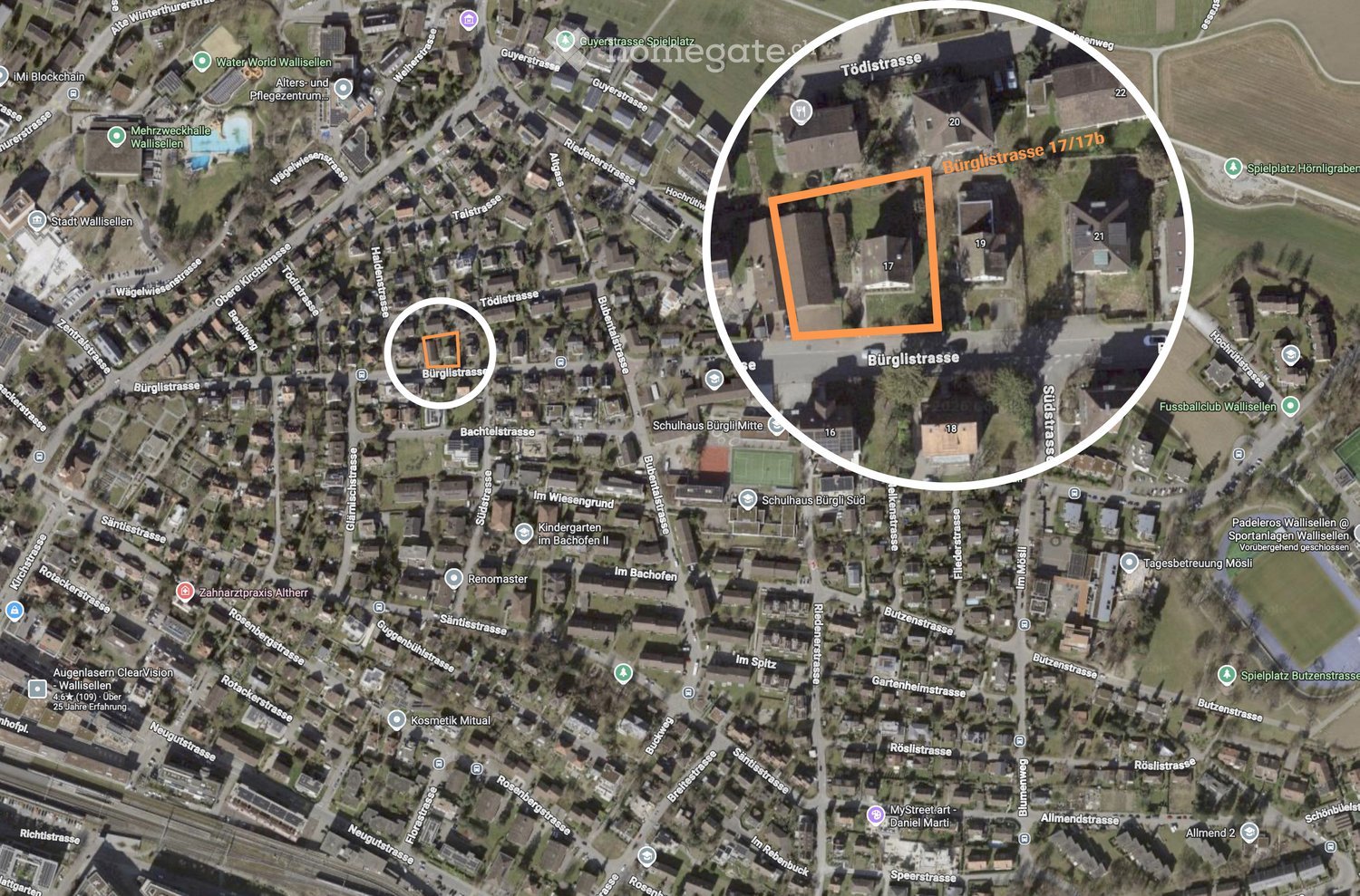 Aerial view of a residential area with streets, buildings, and landmarks such as schools and parks.