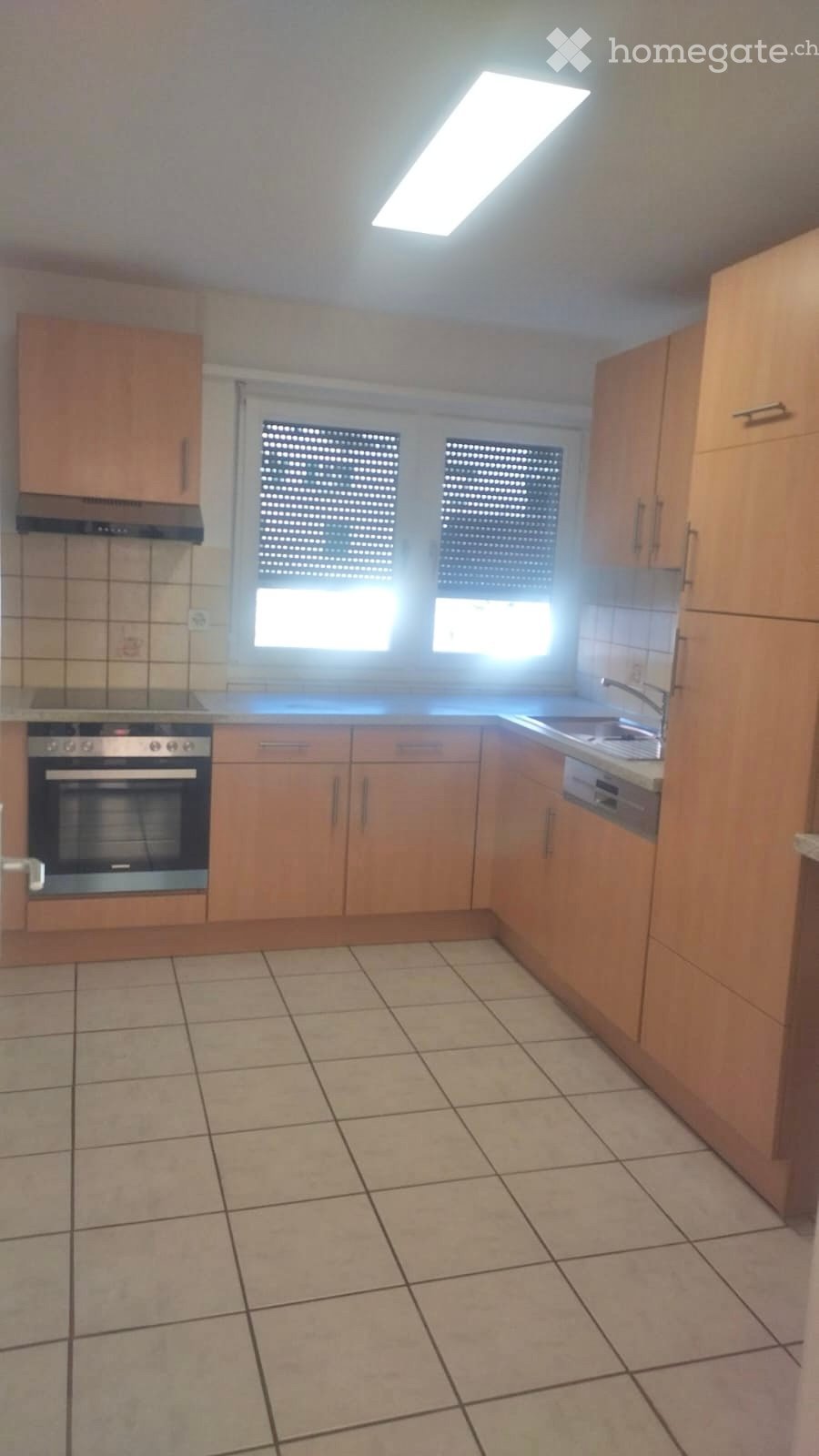 Kitchen, oven, stove, dishwasher, sink, windows, wooden cabinets, tiled floor