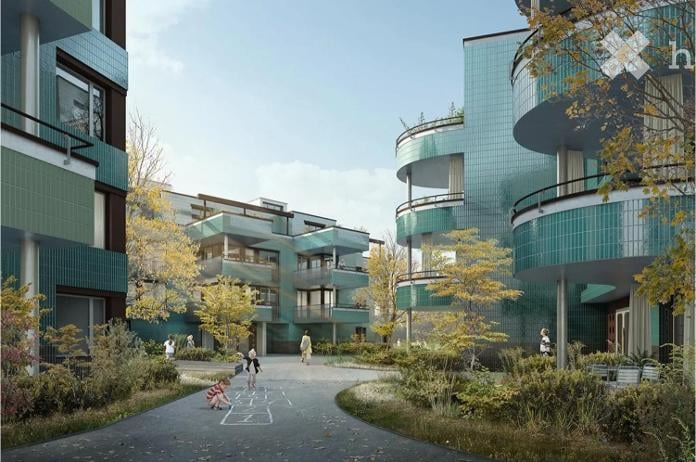 Modern residential complex with green tiled facades, multiple levels, balconies, and landscaped courtyard with trees and pathways.
