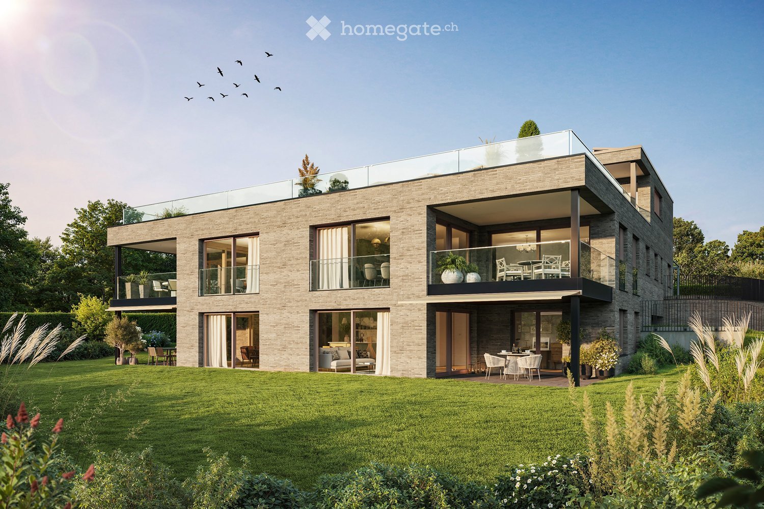 Modern two-story house with large windows, balconies, and a spacious lawn. The house features a sleek, contemporary design with a stone facade and glass railings on the balconies.