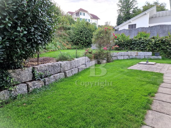 7.5 Zimmer Einfamilienhaus mit Garten, Doppelgarage und Baulandreserven 9