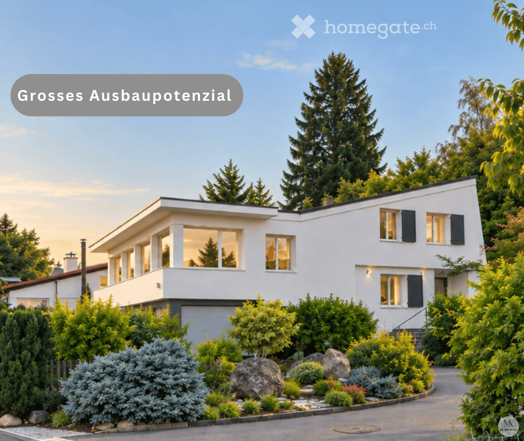 Modern two-story white house with large windows, surrounded by lush greenery and well-maintained garden.