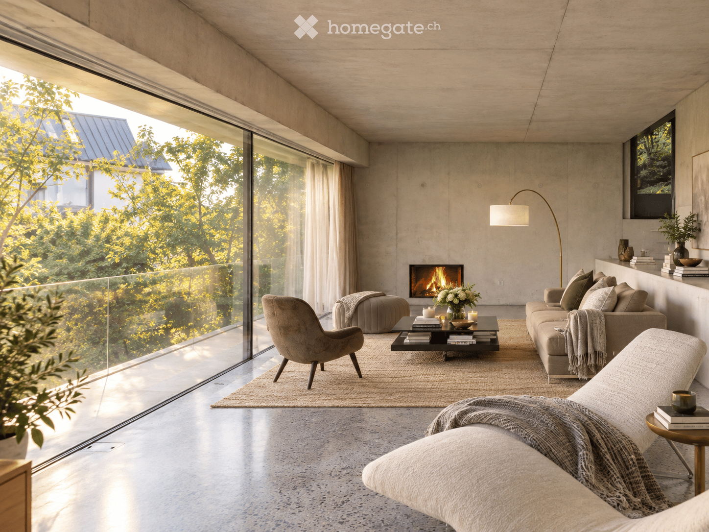 Modern living room with large windows offering a view of greenery, a fireplace, a sofa, armchairs, a coffee table, and a floor lamp.