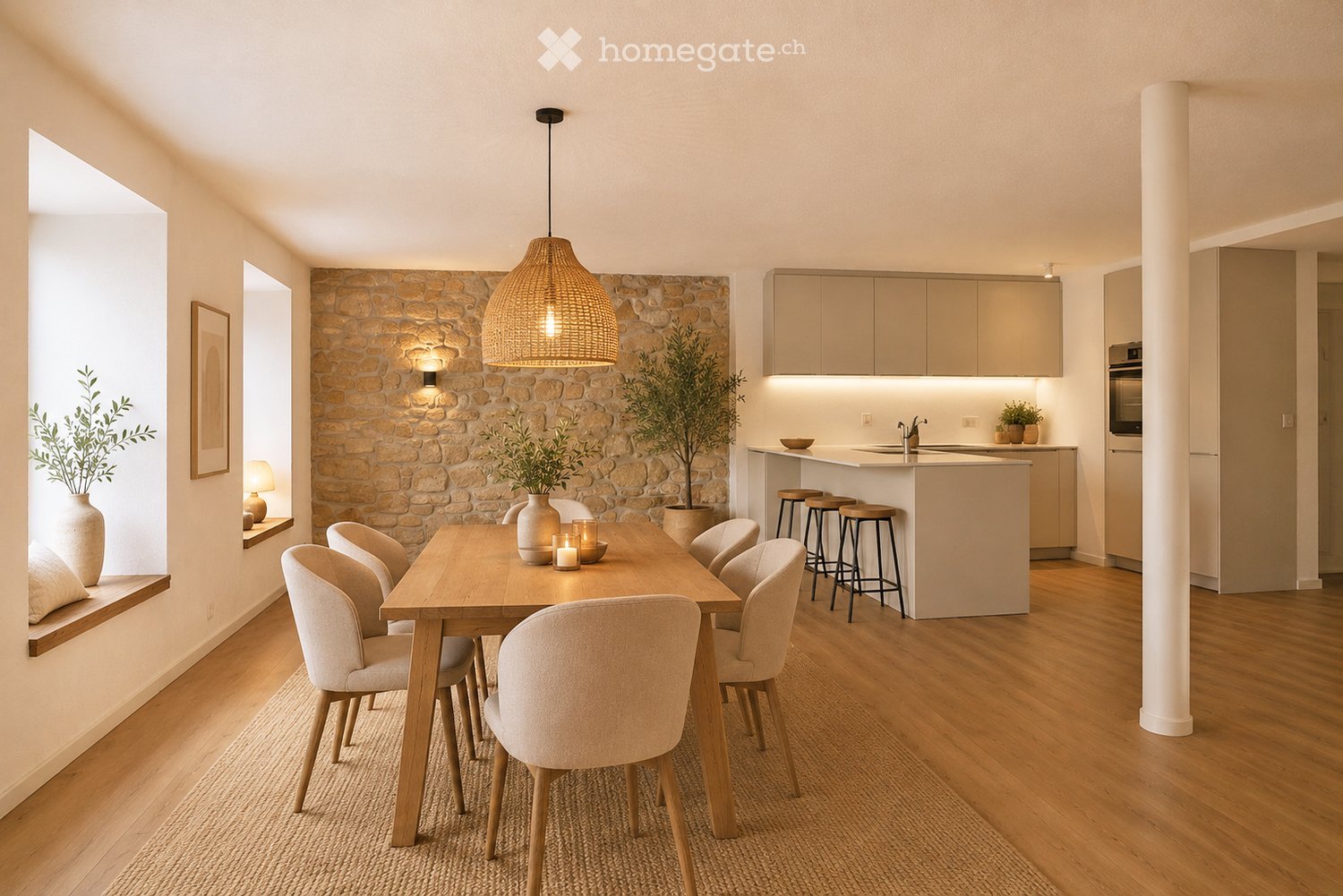 Open-plan dining and kitchen area with wooden flooring, a stone accent wall, a large pendant light, and modern kitchen cabinets.