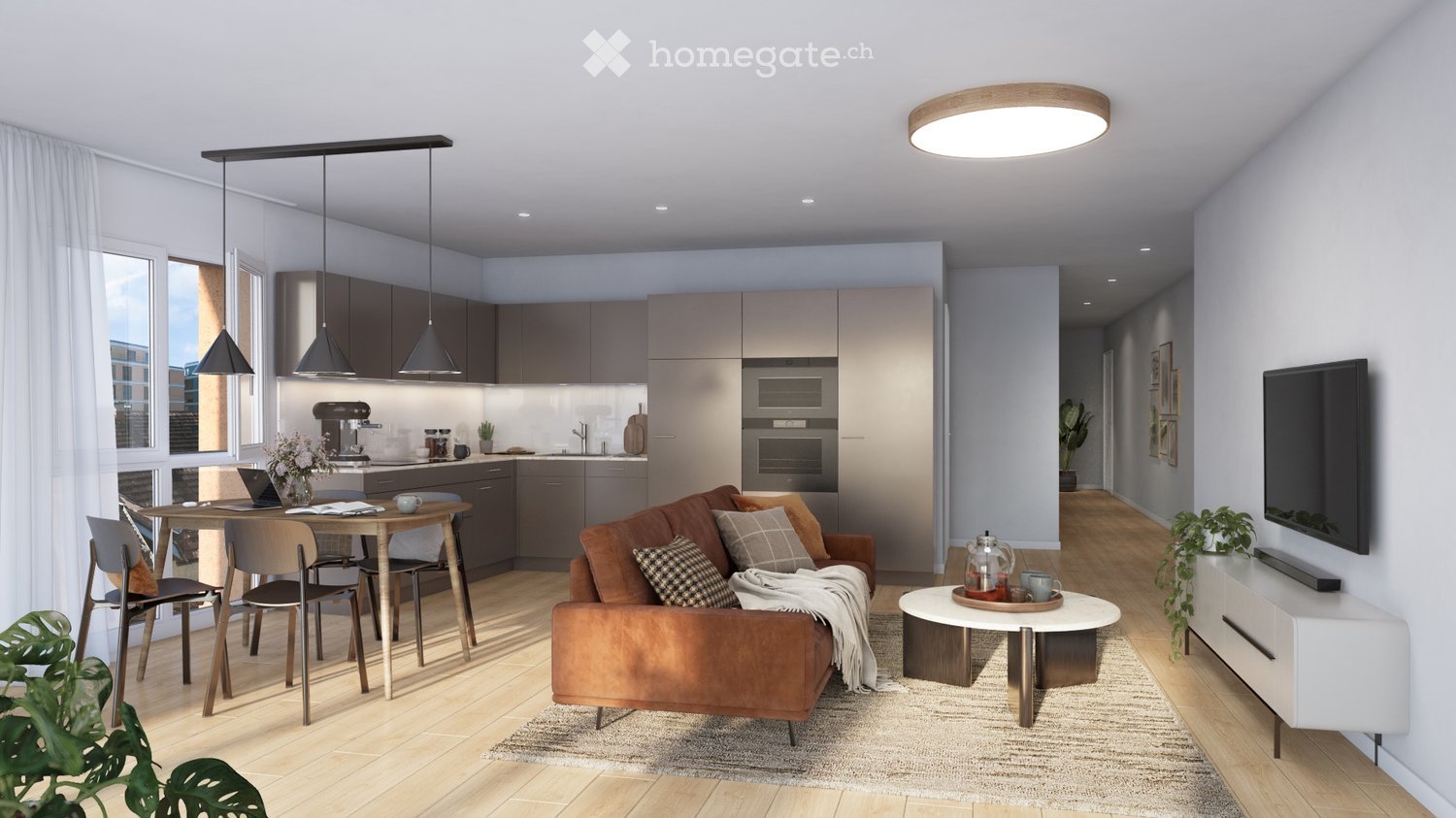 Modern open-plan living and dining area with a brown leather sofa, coffee table, dining table with chairs, and a kitchen area with cabinets, appliances, and a pendant light.