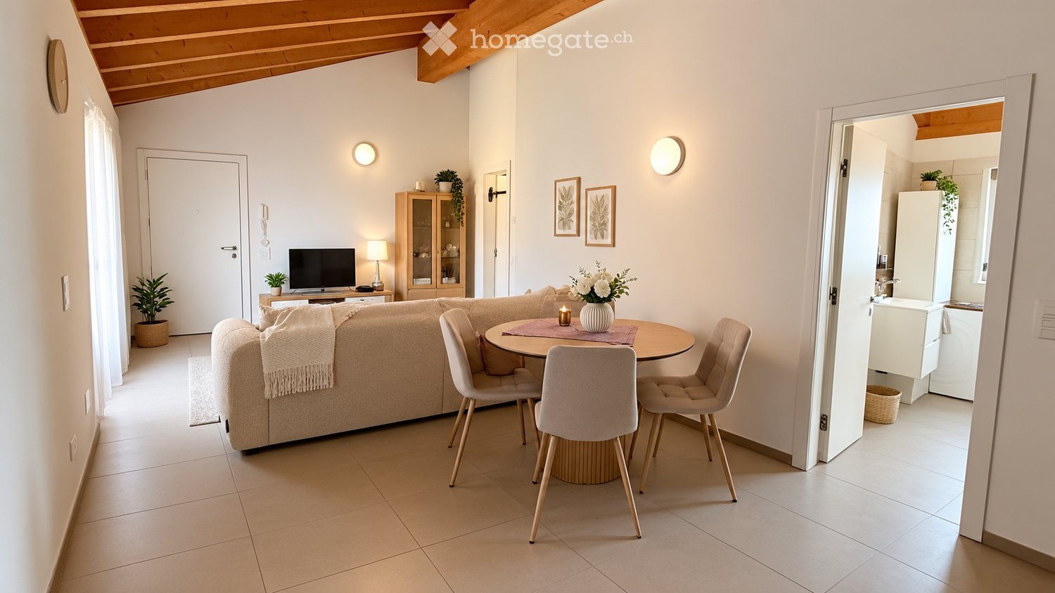 Bright living room with a beige sofa, coffee table, dining table with chairs, TV, cabinet, and decorative plants.