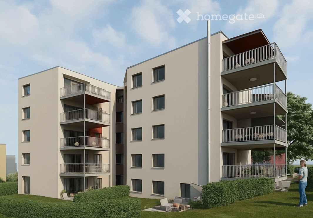 Modern multi-story apartment building with balconies, large windows, and a landscaped lawn area.