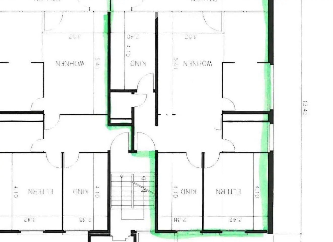 Floor plan of a house with two bedrooms, a living room, a kitchen, and a bathroom.