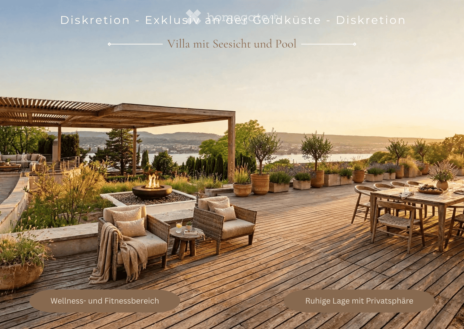 A spacious wooden deck with a fire pit, seating area, dining table, and potted plants, overlooking a scenic view of the water and distant hills.