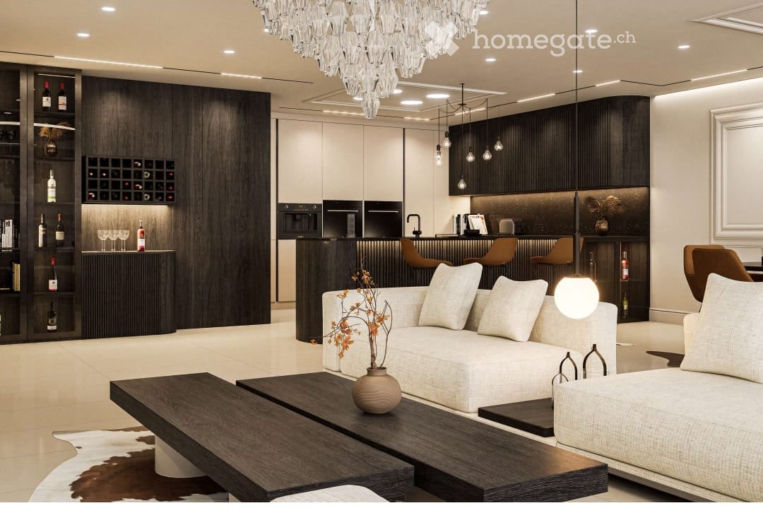 Modern living room with a white sofa, dark wooden coffee table, wine rack, bar counter with stools, and a chandelier.