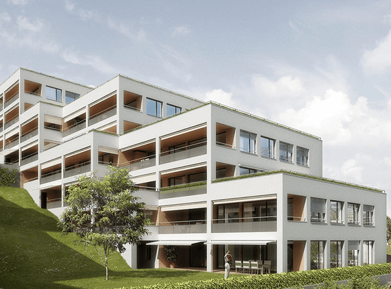 Modern multi-story residential building with white facade, large windows, balconies, and green rooftop.