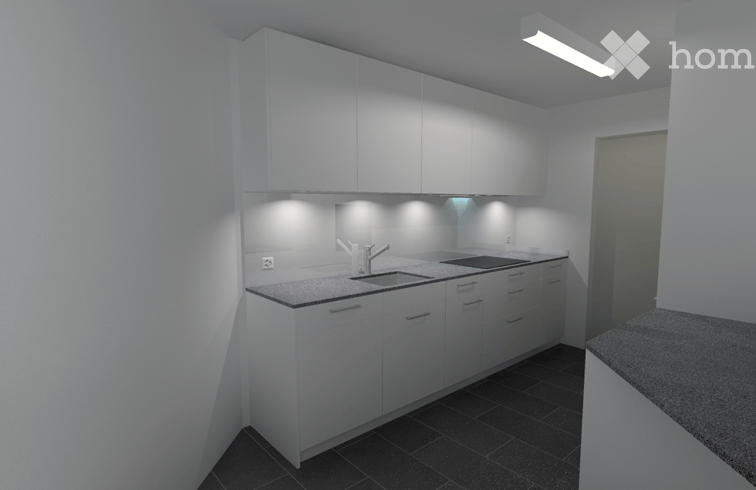 Modern kitchen with white cabinets, a sink, and a countertop. The space is clean and well-lit with built-in lighting under the cabinets.