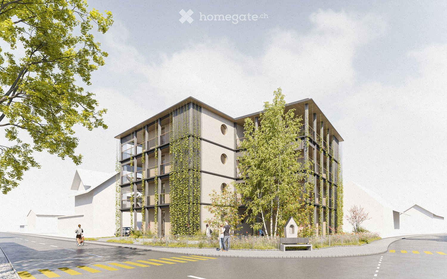 Modern multi-story building with a contemporary design, featuring large windows, balconies, and greenery integrated into the facade. The building is surrounded by trees and a paved area with a few pedestrians.