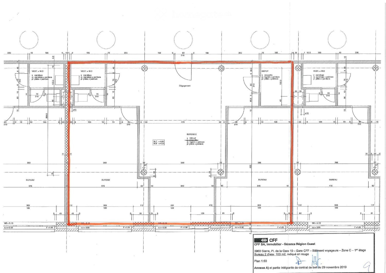 Floor plan of a building showing multiple rooms including offices, bathrooms, and a storage area. Dimensions and room labels are indicated, with Bureau 2 highlighted in red.