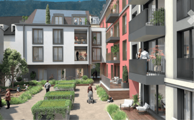 A modern residential complex with multiple apartment buildings, balconies, and a landscaped courtyard area with greenery and seating.