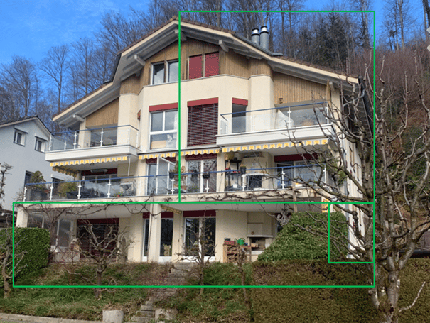 Two-story house with a modern design, featuring large windows, balconies, and a covered terrace area.