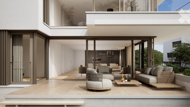 Modern, minimalist living room with large glass doors leading to a spacious balcony. The room features a grey sofa, a coffee table, a couple of armchairs, and a small ottoman. The balcony has a modern design with a round seating area and a small table.