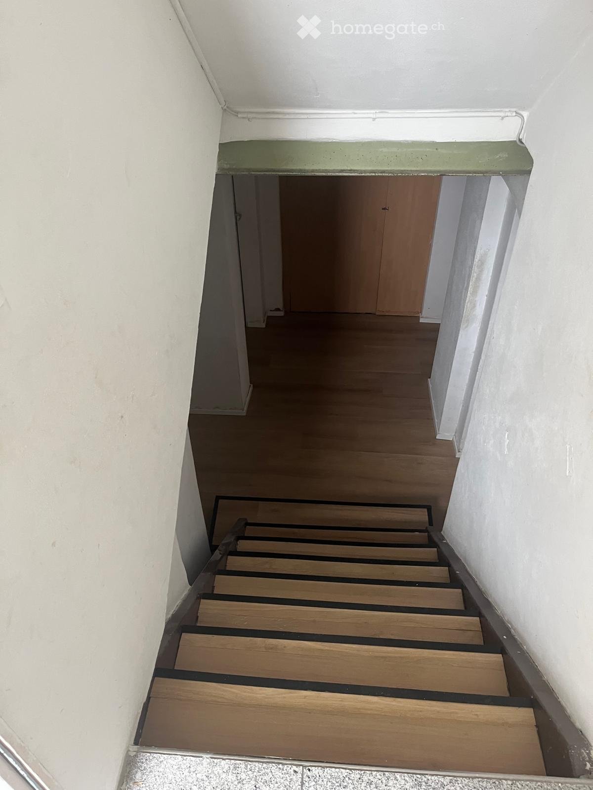 wooden steps, white walls, wooden floor, wooden door