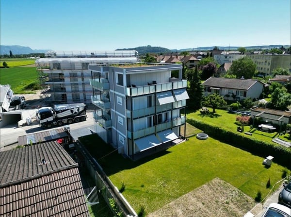 Neubau-Mehrfamilienhaus mit 4 Wohnungen und Einstellhalle - Stockweg 6, Studen BE 9