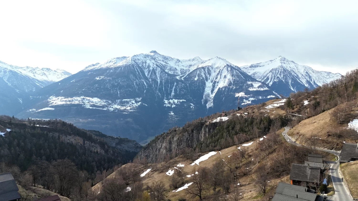 Mountains, trees, houses, road, snow