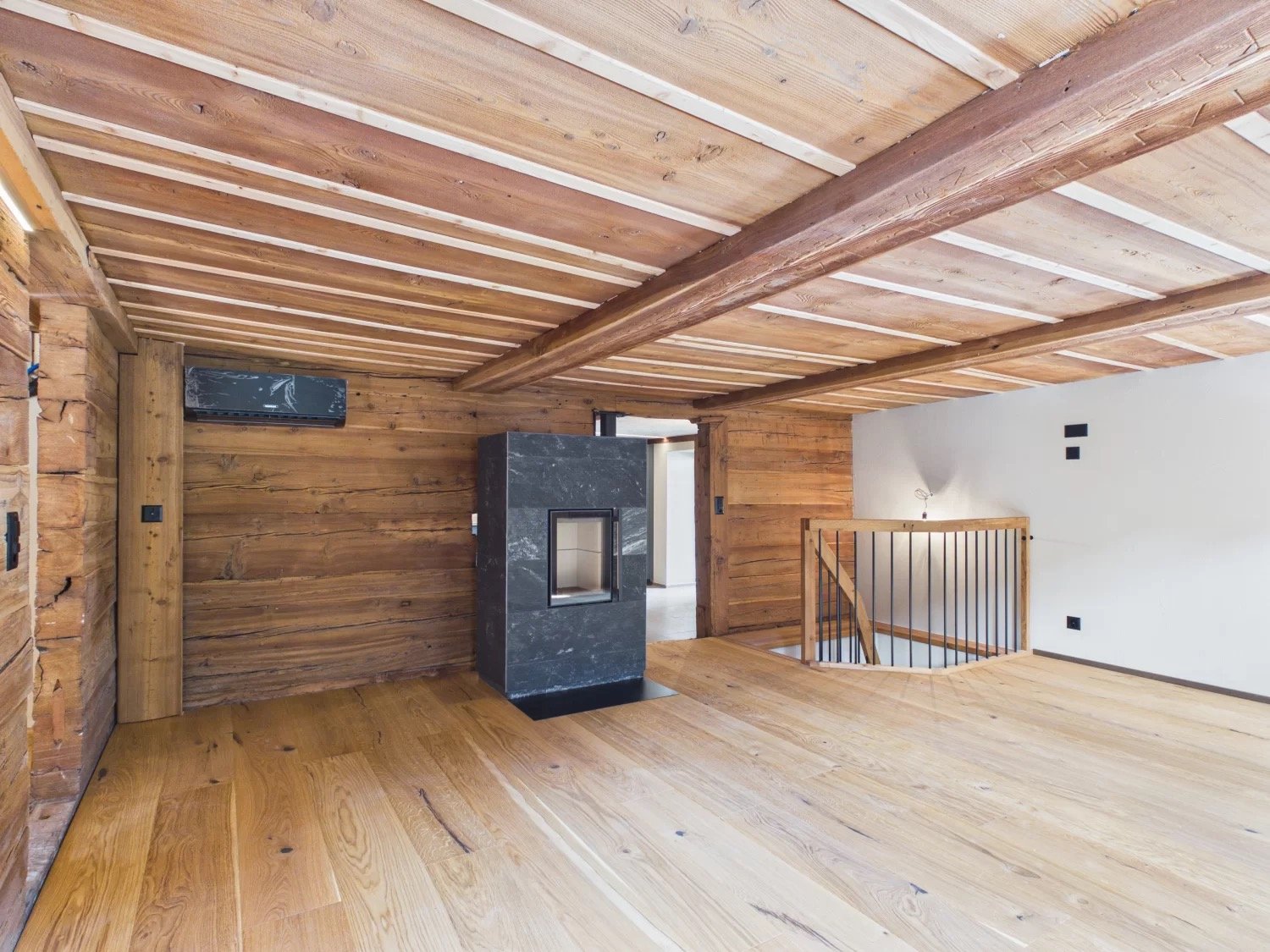 wooden walls, wooden floor, fireplace, staircase