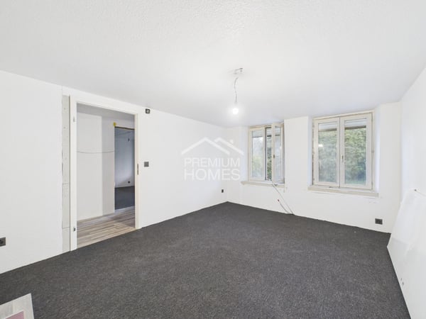 Vielseitiges Mehrfamilienhaus mit Ausbaupotenzial und bewilligter Erwe 10