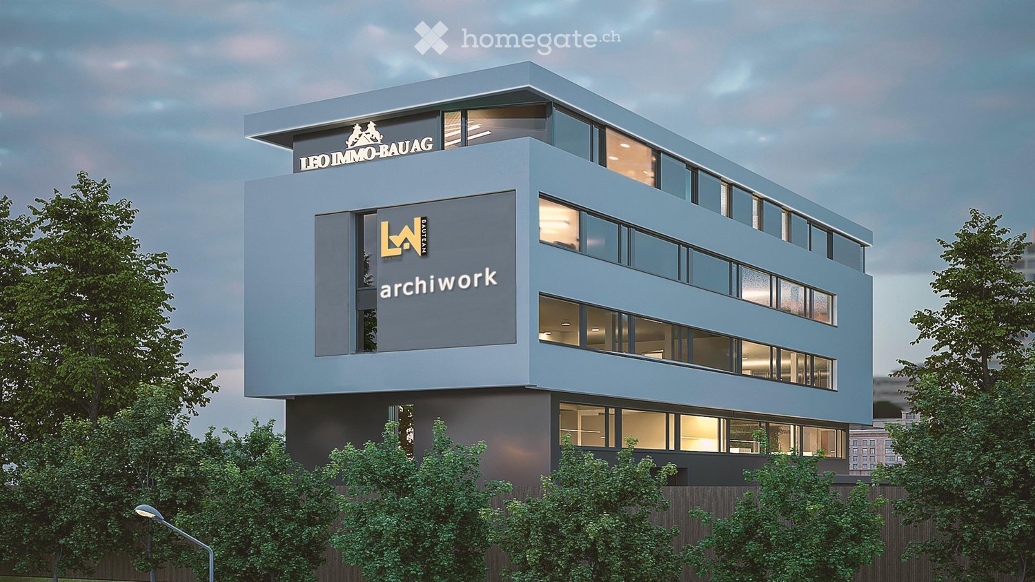 Modern office building with blue exterior, multiple glass windows, logo on the top, surrounded by trees.