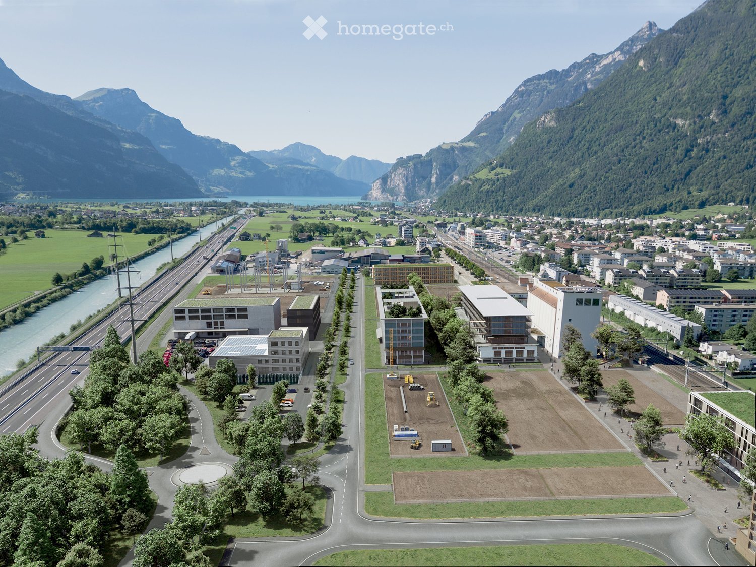 Cityscape with many buildings, green landscape, mountains, water