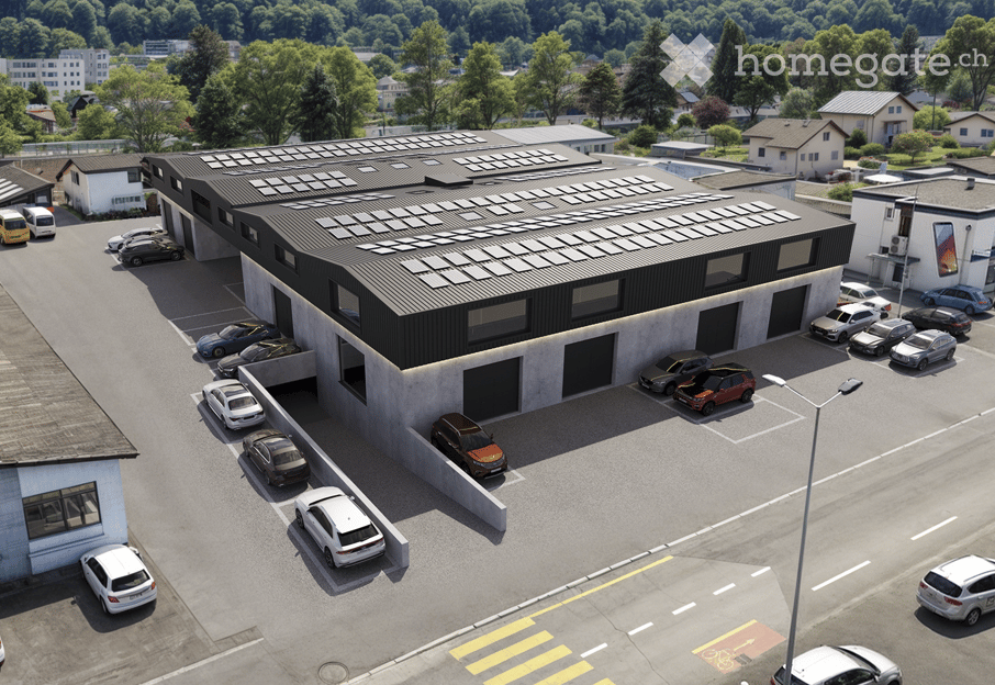 Commercial building with solar panels on the roof, multiple parking spaces, modern design, surrounded by trees and other buildings