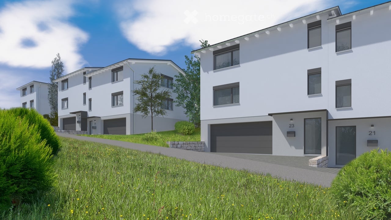 Three white apartment buildings, each with a garage, on a sloped area with grass and bushes
