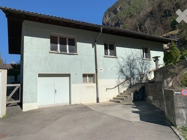 2 story house, blue and white paint, garage, stairs, windows, driveway
