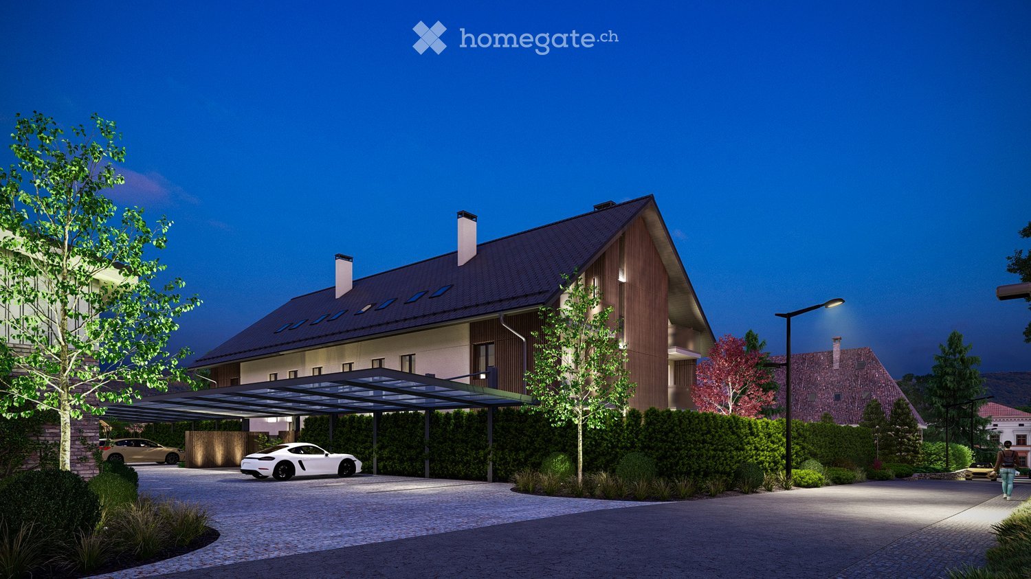 Modern two-story house with a sloped roof, wooden facade, and covered driveway. Features include a garage, landscaped garden, and parked cars.