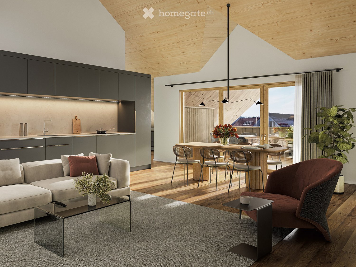 Modern open-plan living and dining area with a grey sofa, glass coffee table, dining table with chairs, and a sleek kitchen area with dark cabinets and a sink.