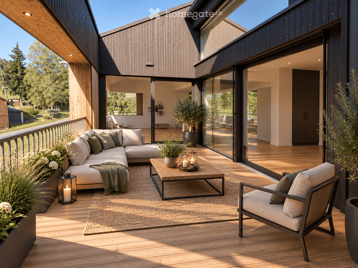 Modern outdoor balcony with wooden decking, a sectional sofa, coffee table, armchair, lantern, and potted plants.