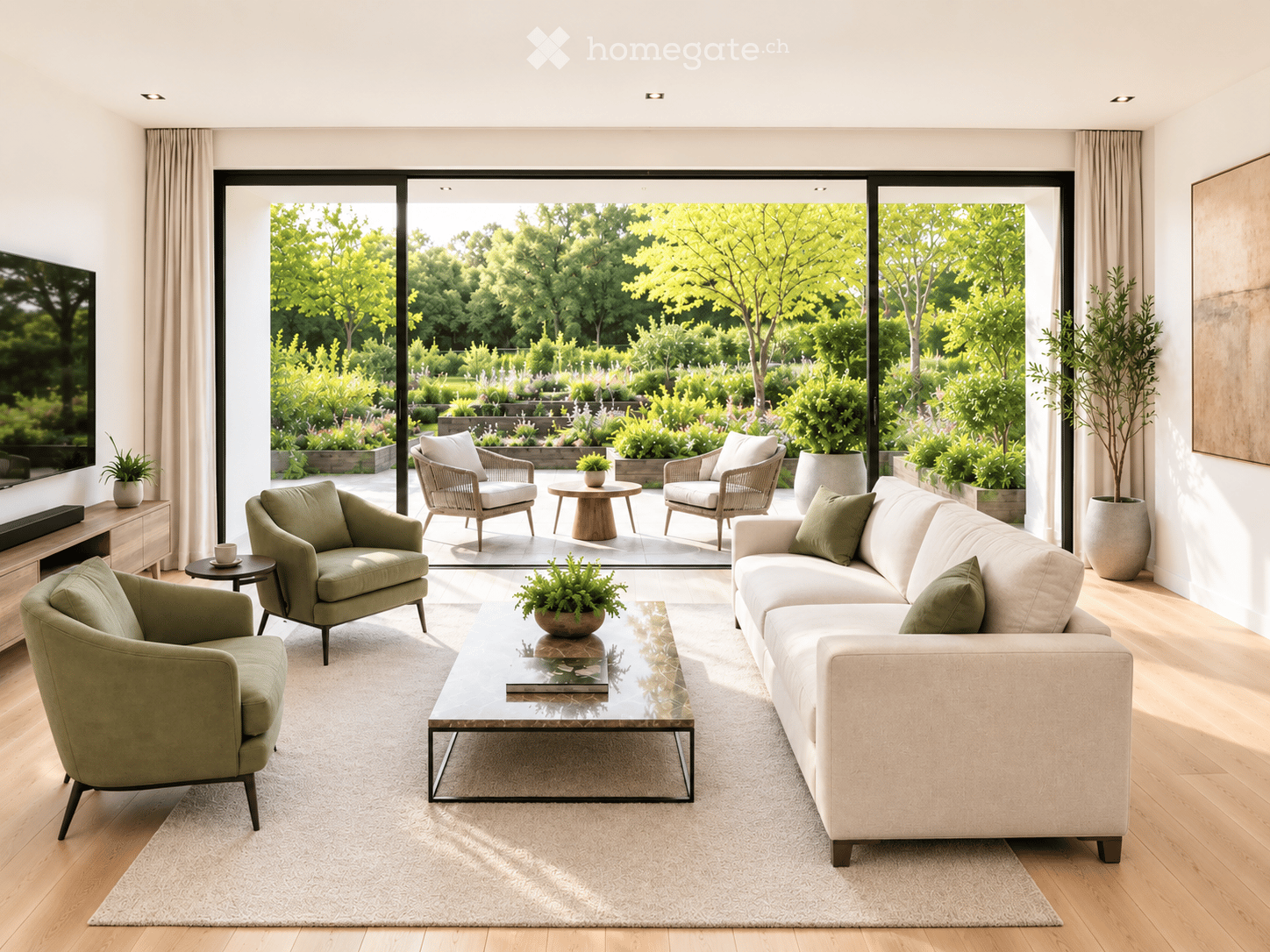 Modern living room with large glass doors opening to a garden, featuring a cream sofa, green armchairs, a glass coffee table, and a TV on a wooden stand.