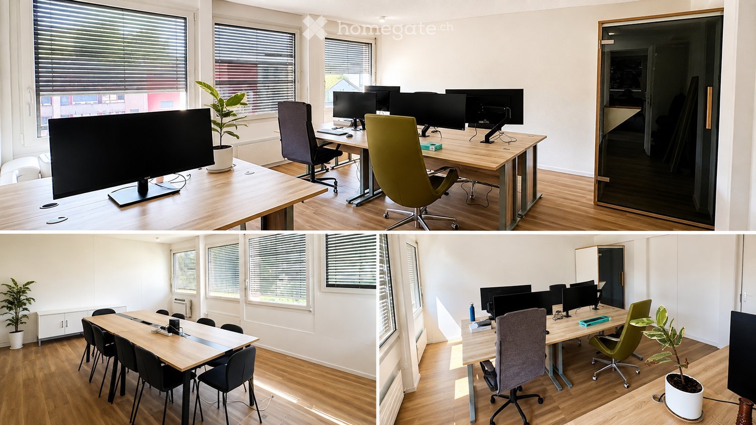 Modern office space with multiple workstations, large wooden tables, ergonomic chairs, multiple computer screens, and potted plants.