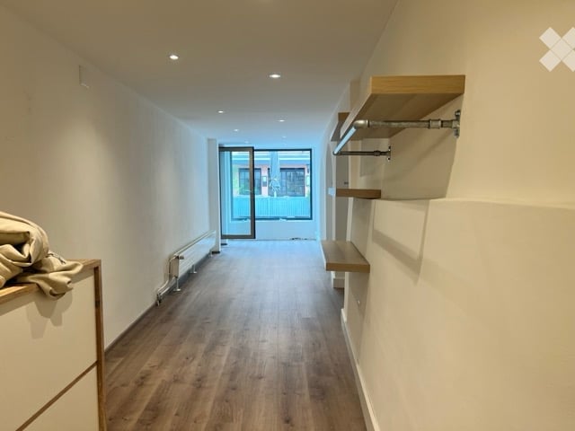 wooden floors, white walls, wall shelves, glass door