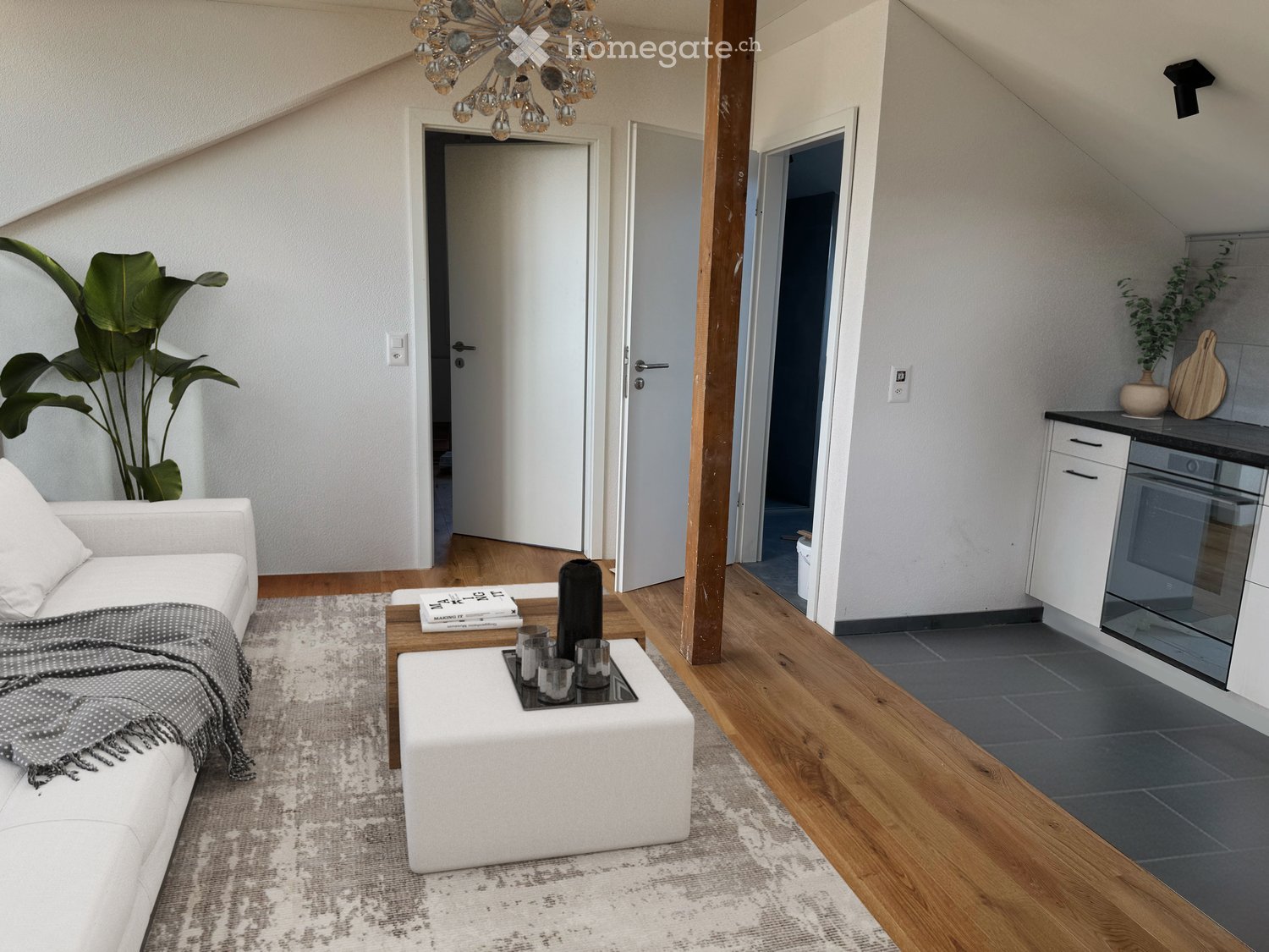 living room, white couch, table, chandelier, open doors, kitchen