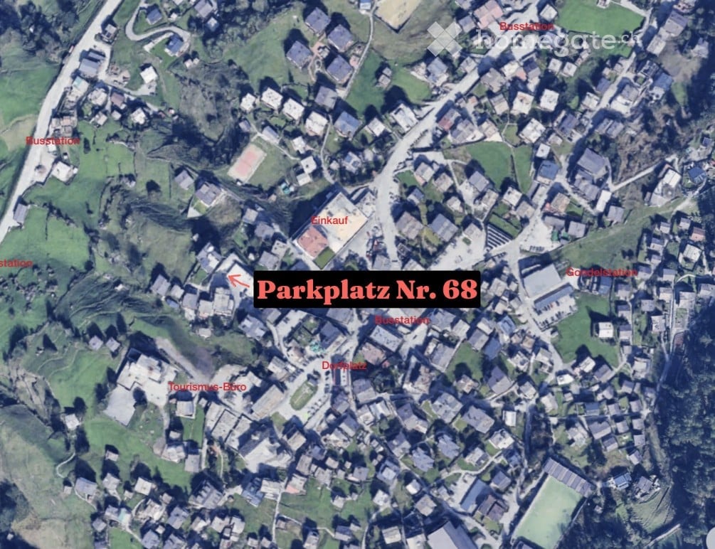 Aerial view of a town with labeled parking spot number 68, surrounded by buildings and green spaces.
