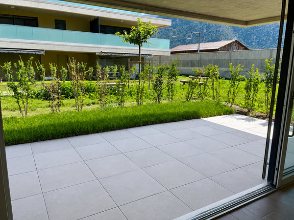 REZ avec grande terrasse – Neuf – Place de parc intérieure 1