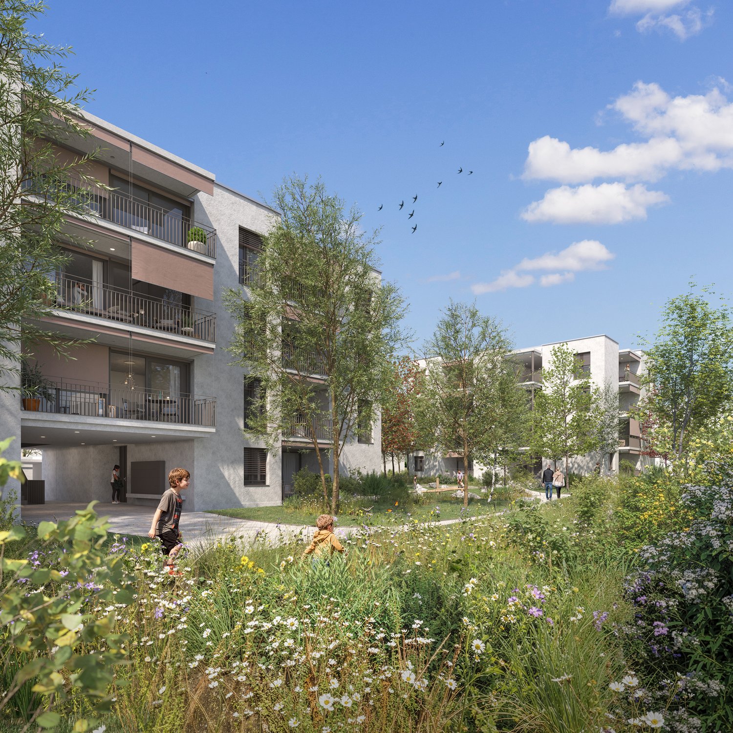 Multi-story apartment building with balconies, surrounded by lush greenery and a well-maintained garden with flowering plants and trees. People can be seen walking through the outdoor common area.