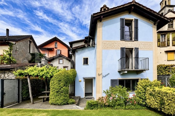 Casa con giardino e 4 posteggi 1