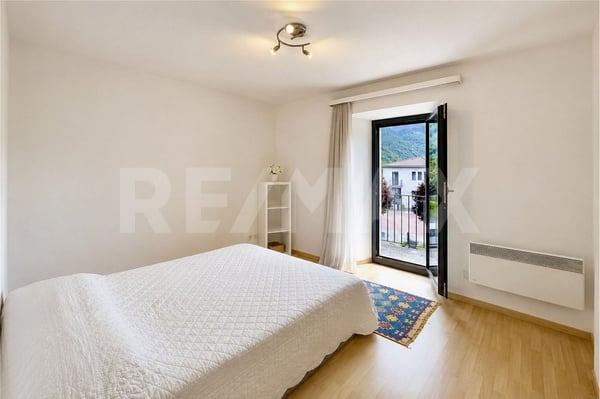 Casa con giardino e 4 posteggi 4