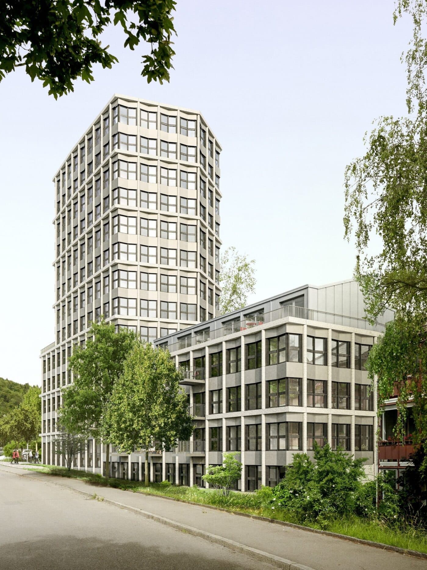 Modern high-rise building with multiple floors, large windows, balconies, and a modern architectural design.