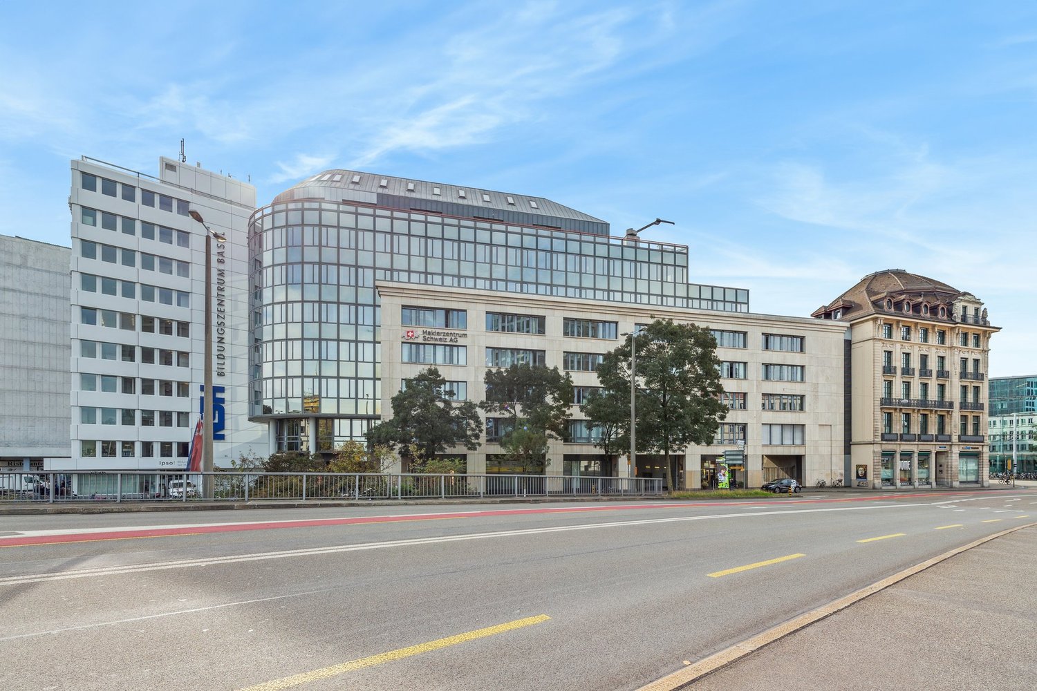 large building, glass windows, modern architecture, trees, street lights, large road